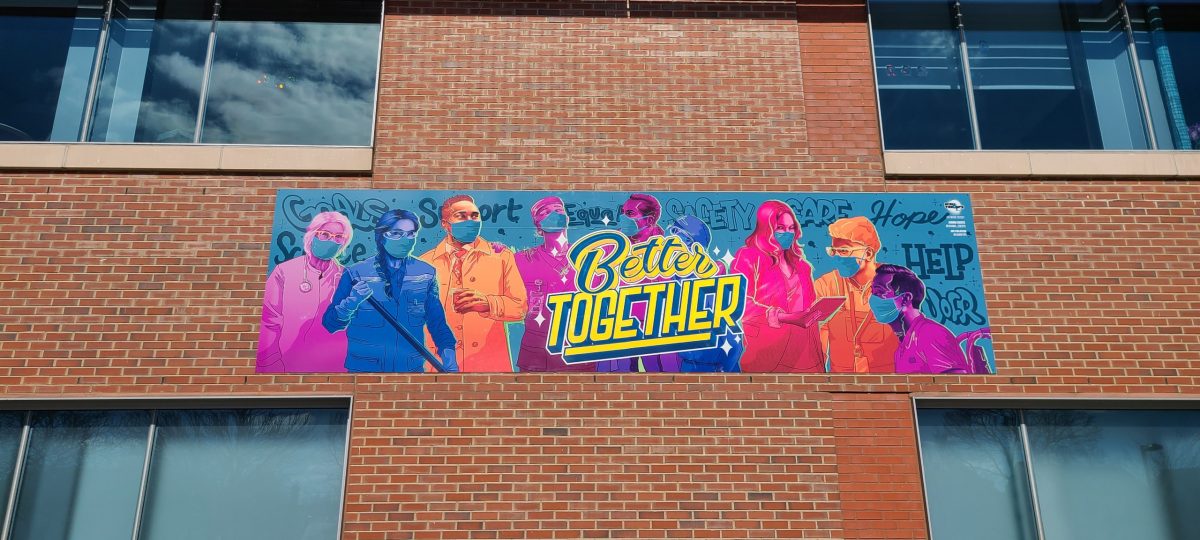 WT x URMC Better Together Mural installed on a brick wall at U of R Medicine